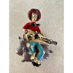 Vintage 1940s gold tone pot metal enamel man guitar playing figural brooch